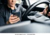 driving-distracted-by-phone-car-260nw-2594307295
